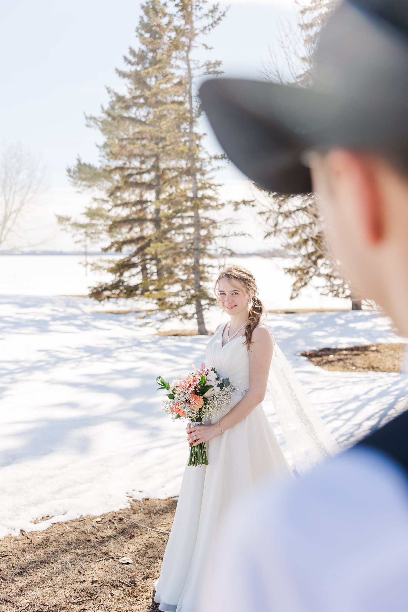 Bride and groom portrait in snowy Alberta field