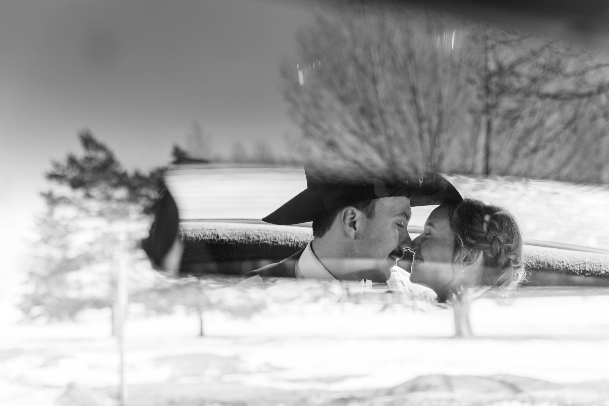 Bride and groom silhouette in winter landscape