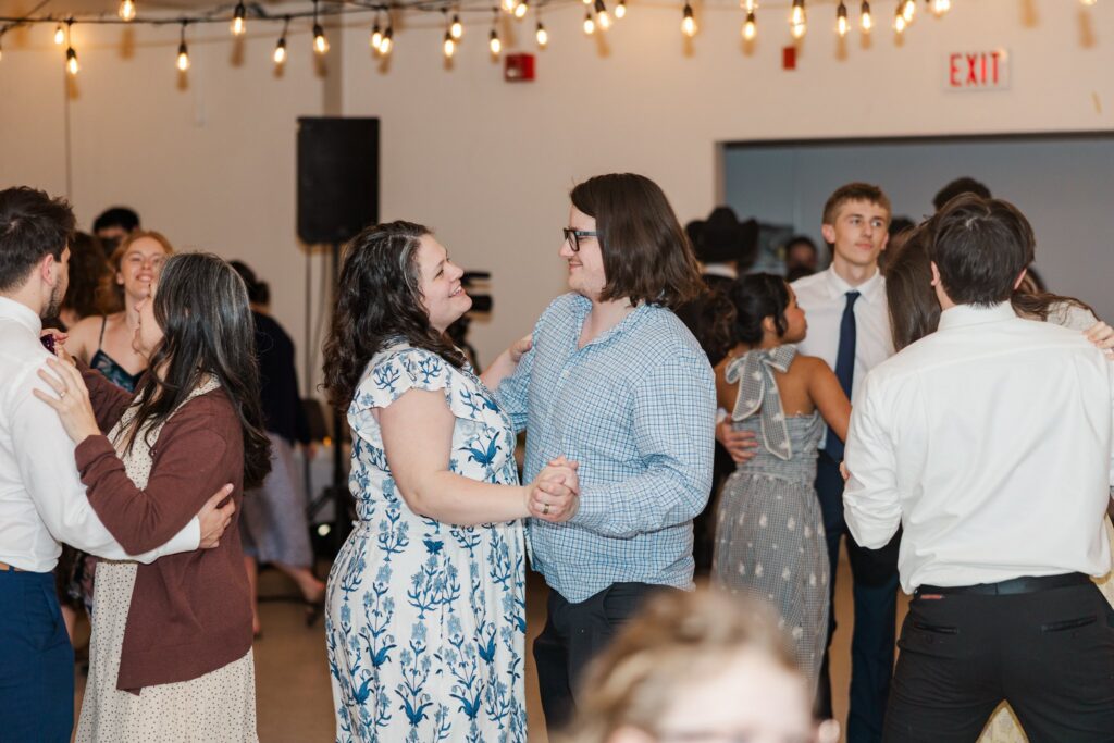 Guests dancing at reception, family on the dance floor