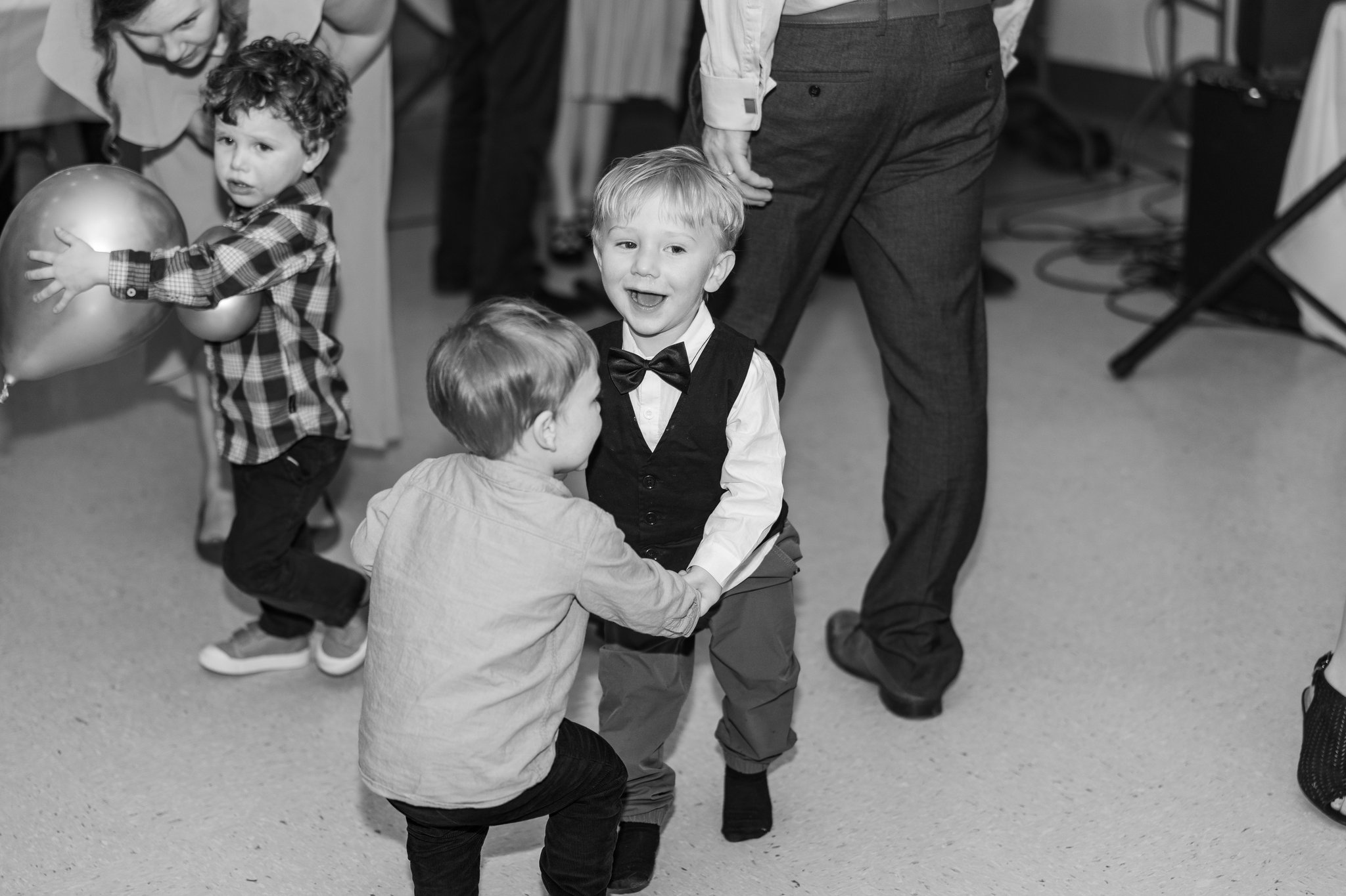 Wedding guests dancing, woman in cowboy boots on the dance floor
