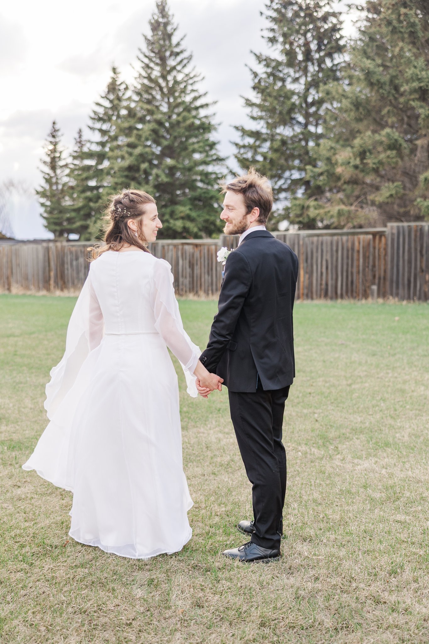 Gabriella and Daniel laughing during golden hour portraits near St. Mary's Cathedral