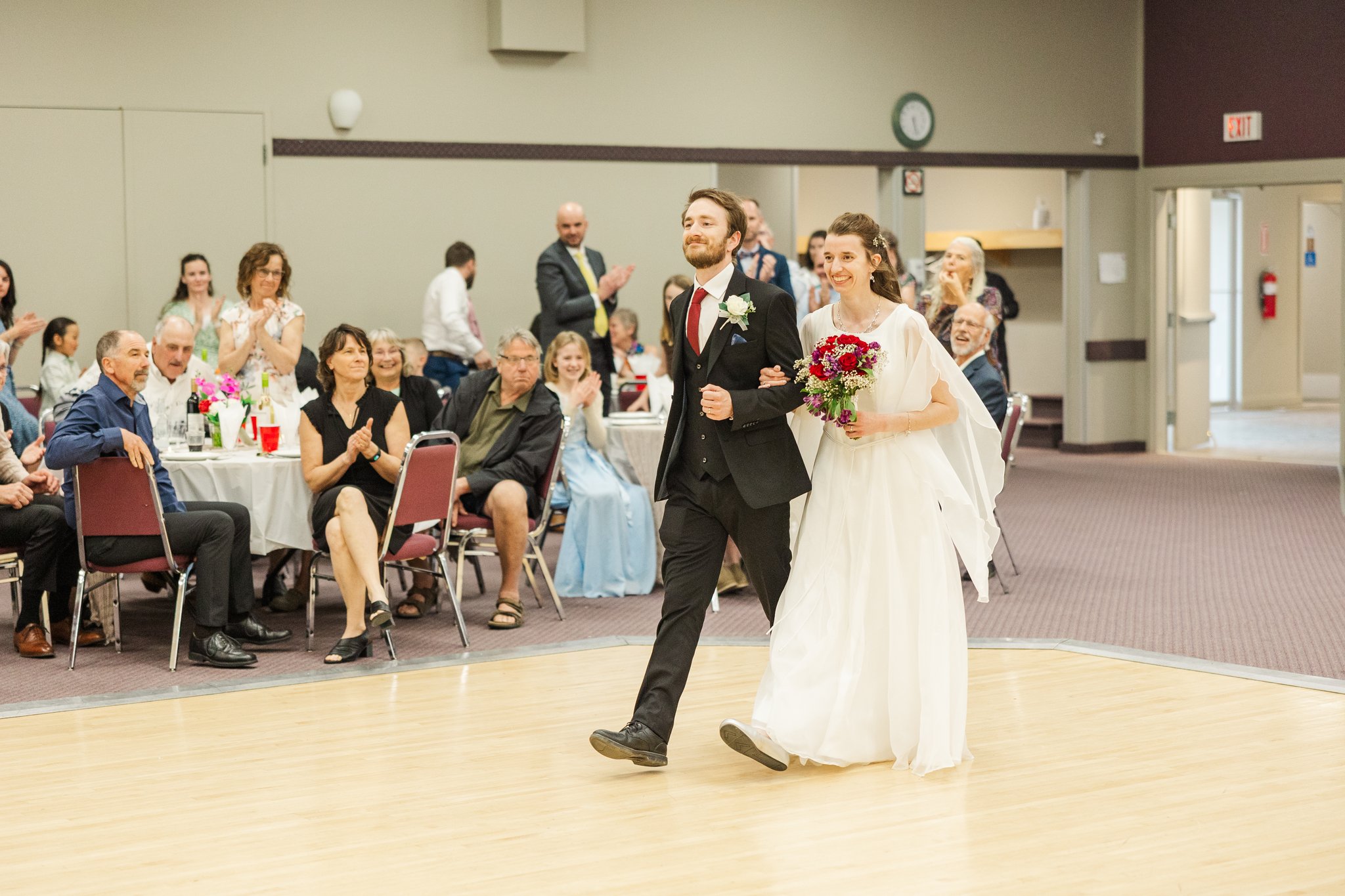 Wide view of guests at Gabriella and Daniel's wedding reception in Carstairs Alberta